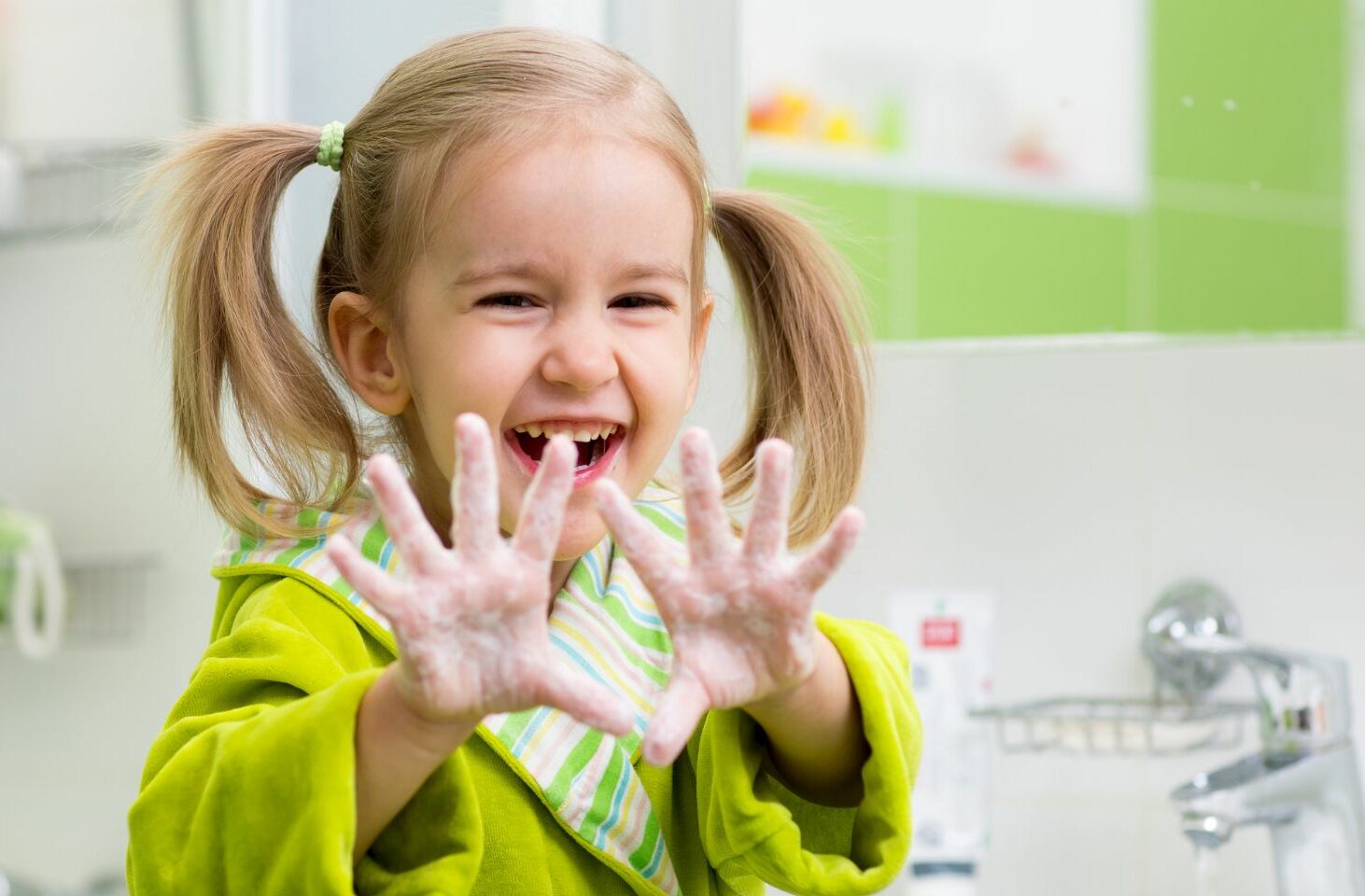 Little girl showing clean hands
